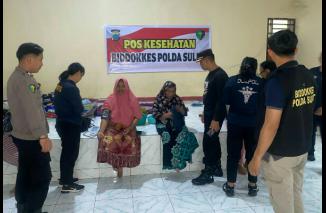 Biddokkes Polda Sulut Berikan Layanan Kesehatan kepada Korban Banjir di Malendeng, Komo Luar dan Tikala