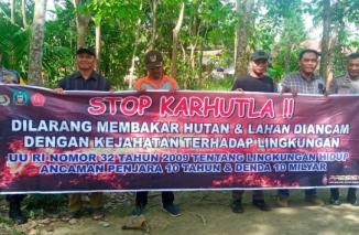 Kanit Binmas Polsek Hinai Aiptu H. Siswanto dan Bhabinkamtibmas Polsek Hinai Aiptu Nur jayadi Imbau Cegah Karhutla